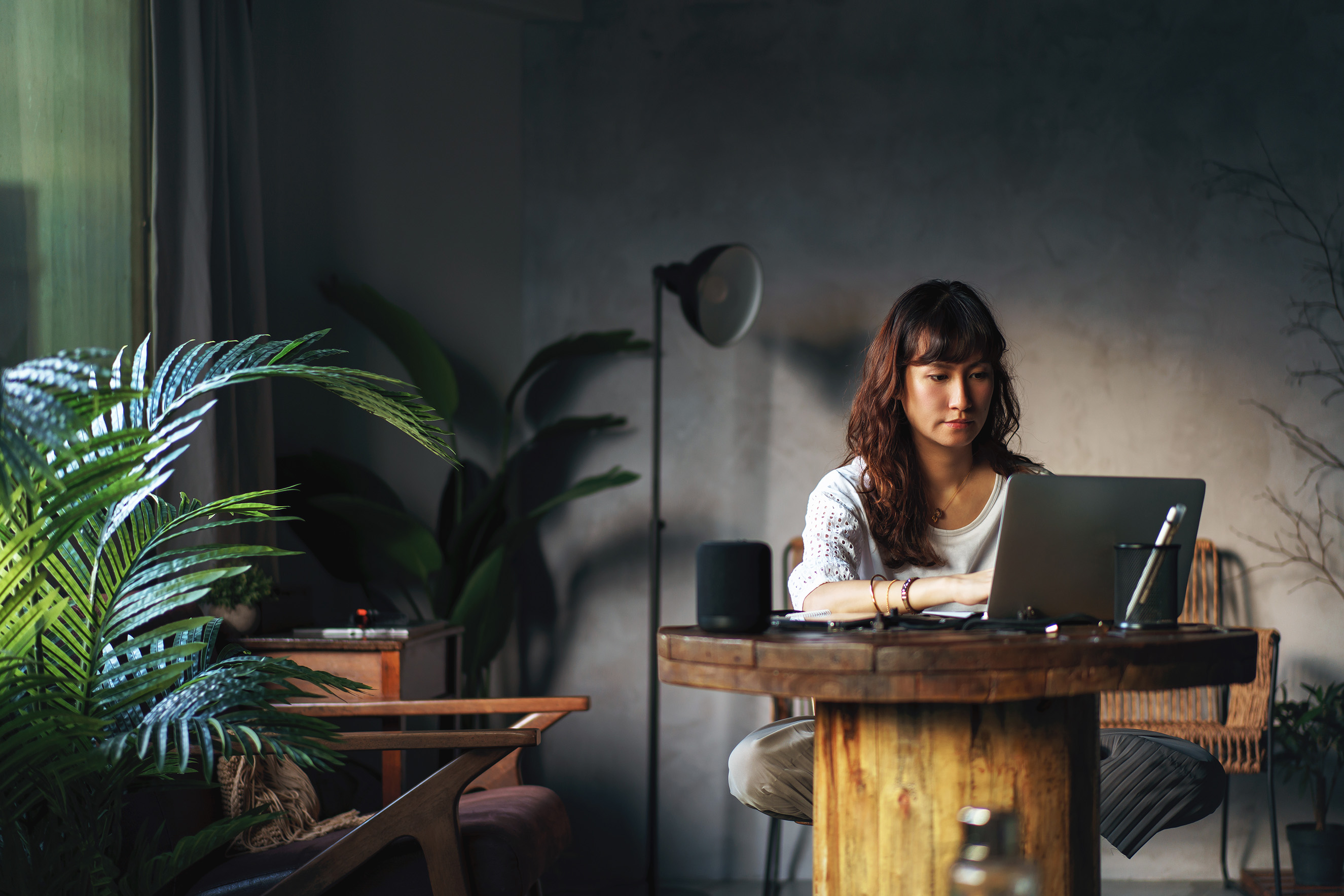 Woman working in room with laptop