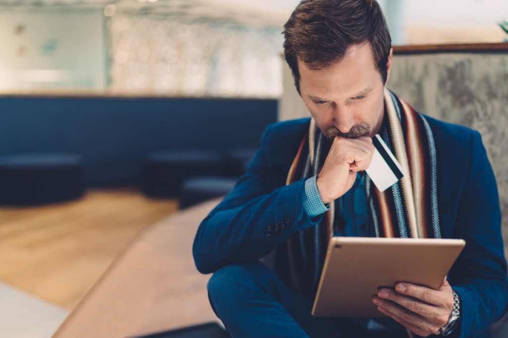 Man thinking about spending money