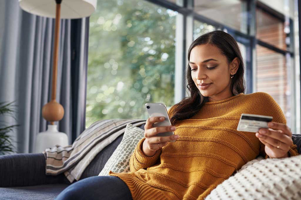 Woman on couch ordering online