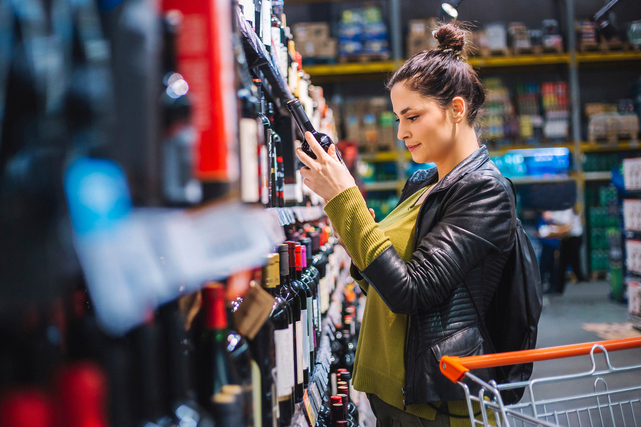 Young adult female grocery shopping