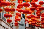 an asian woman standing in a square during a Global online shopping event