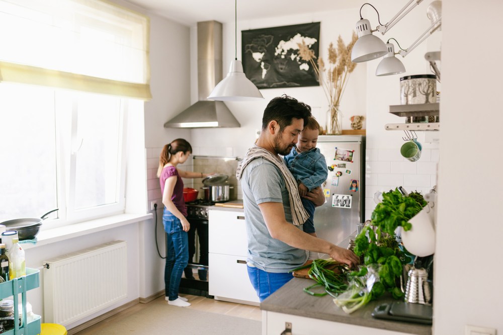 A young family preparing dinner with food from the grocery store