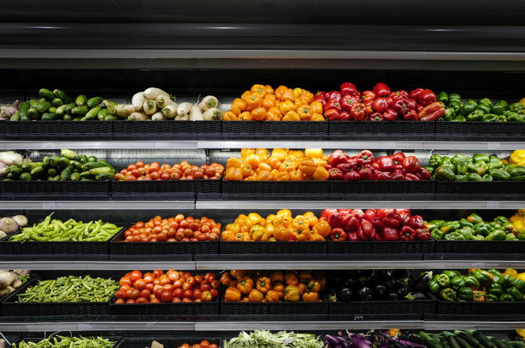 Organic produce in grocery store shelf, Vegetables For Sale In Market.
