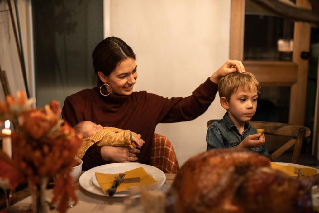 Mother and children enjoying a Thanksgiving meal