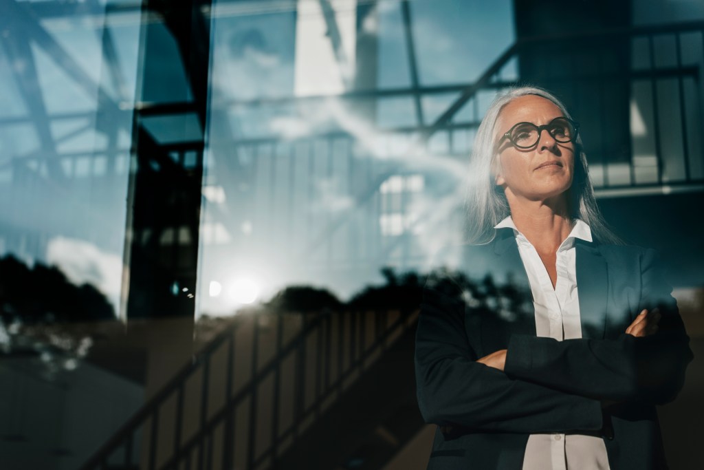 Businesswoman looking out of window