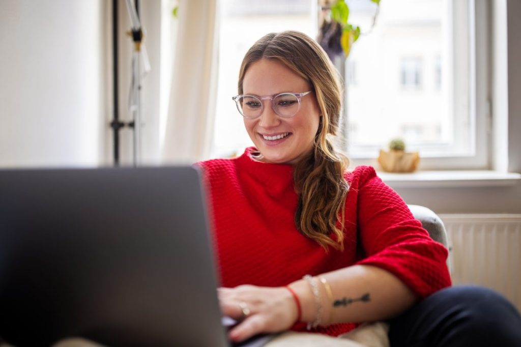 A woman in a red sweater navigating GDSN complexity.