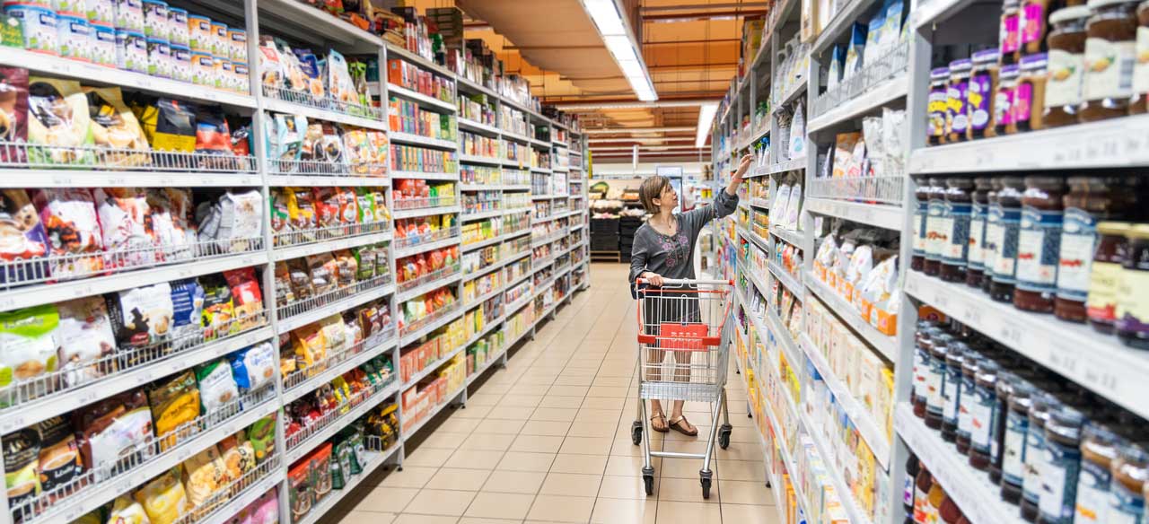 Woman shopping in grocery aisle