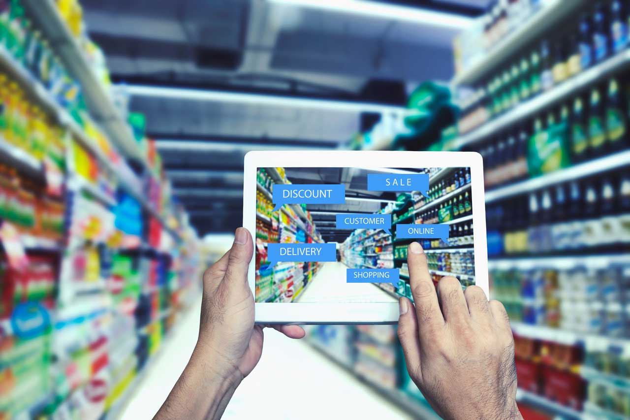 Person holding a tablet with a shelf plan on it in a grocery store aisle