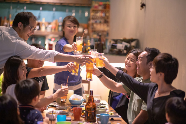 Group of friends toasting with drinks