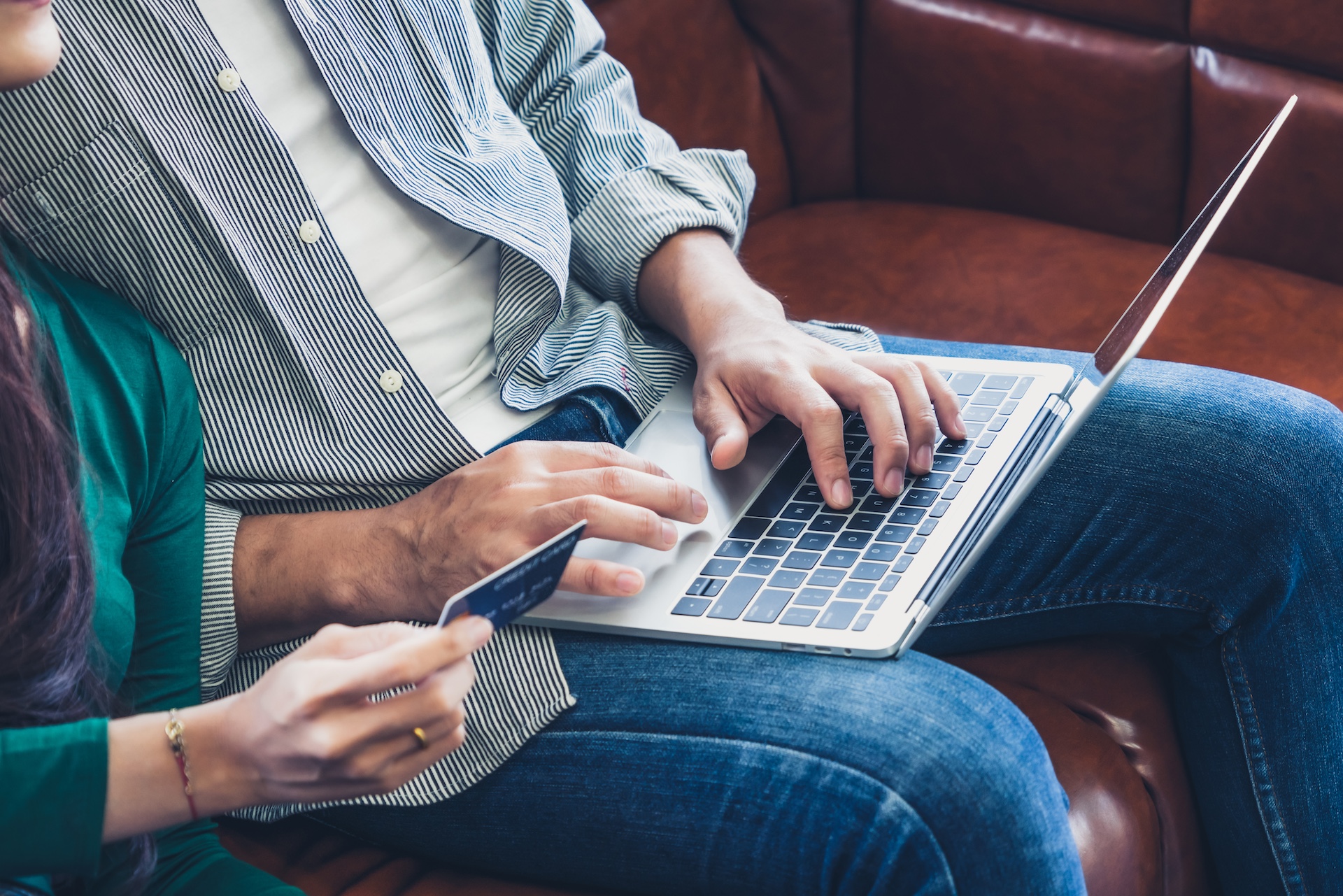 computer on lap making an online purchase