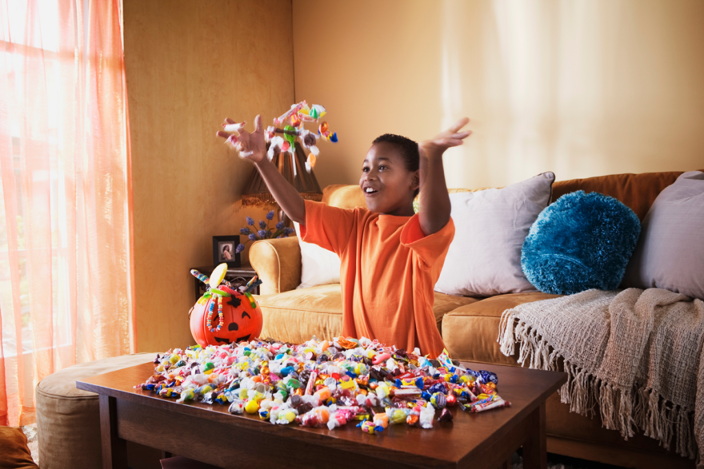 Excited boy with Halloween candy