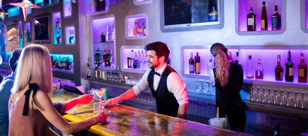 Premium bar - waiter serving a luxury cocktail