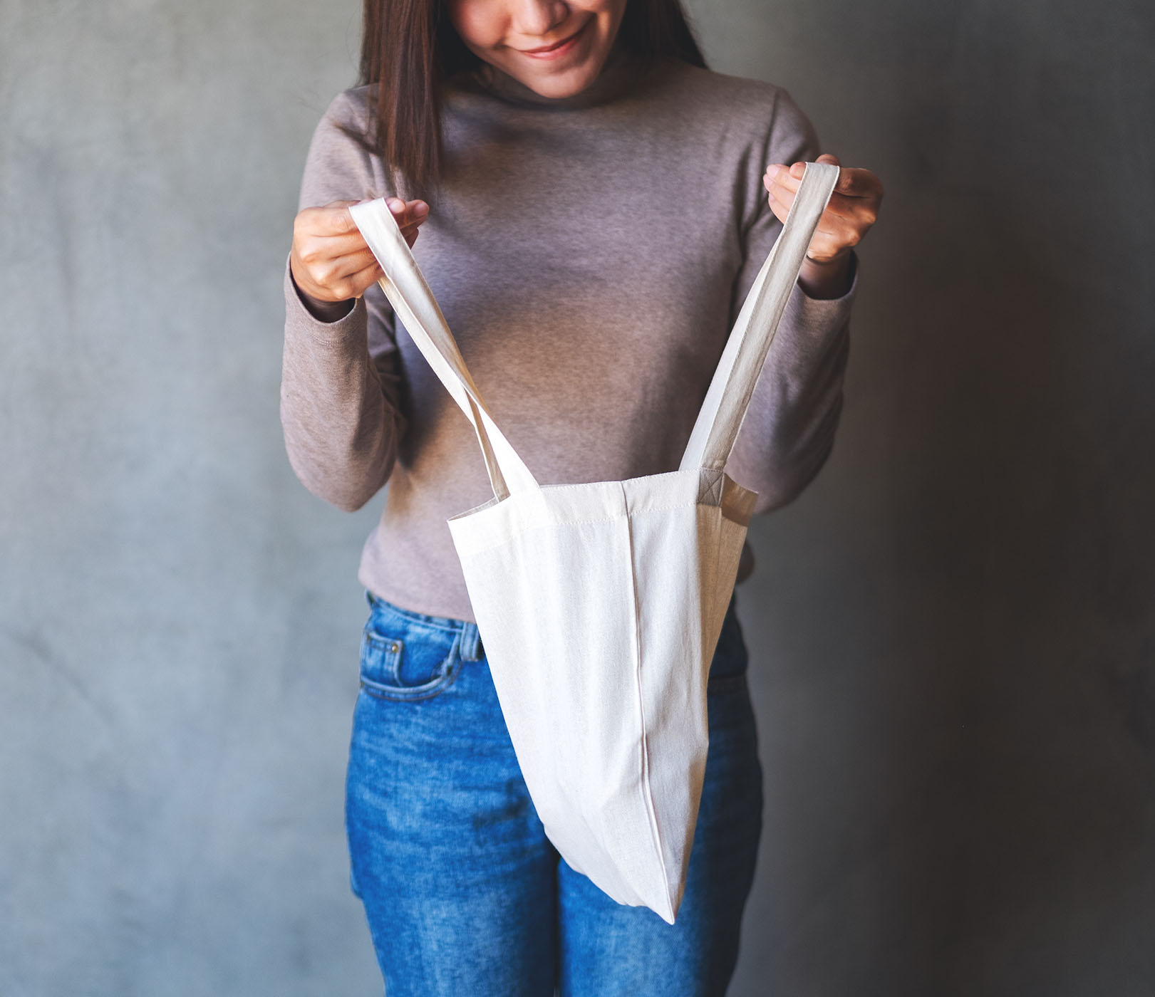Chapter 2 of the Consumer outlook 2026​ report shows a shopper looking into a shopping bag