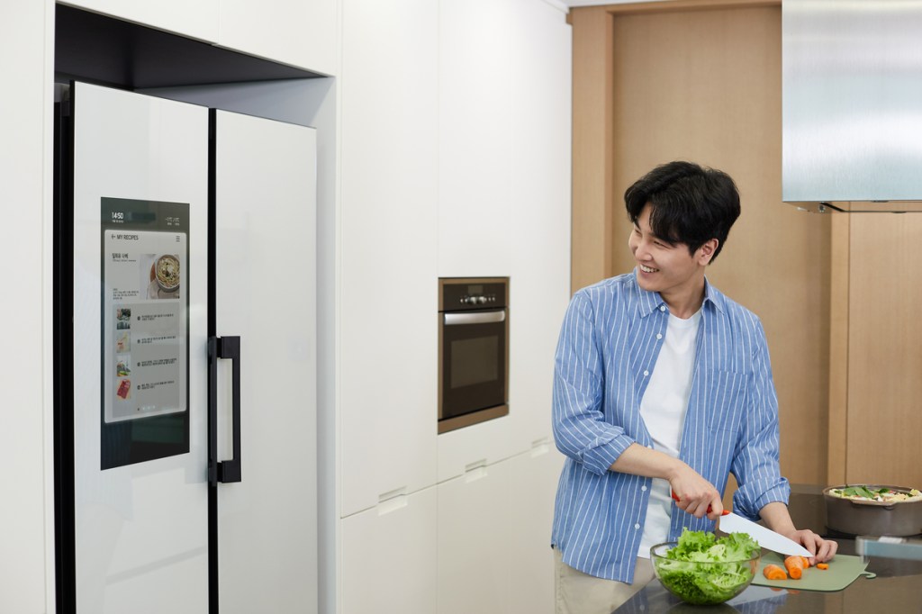 A Man Cutting Carrot in Smart Kitchen