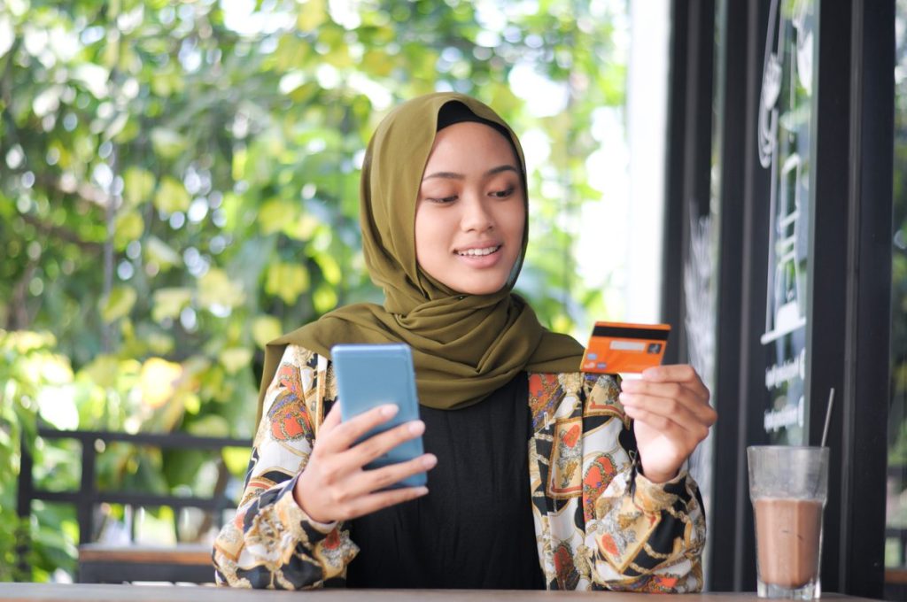 Asian female online shopping, contactless payment