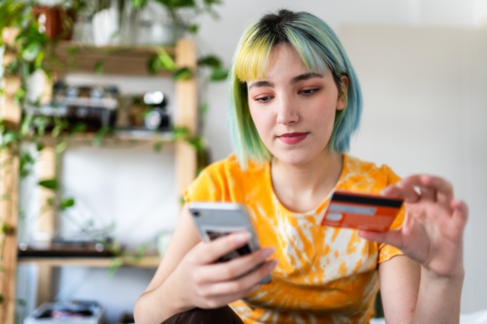 girl buying something with her credit card