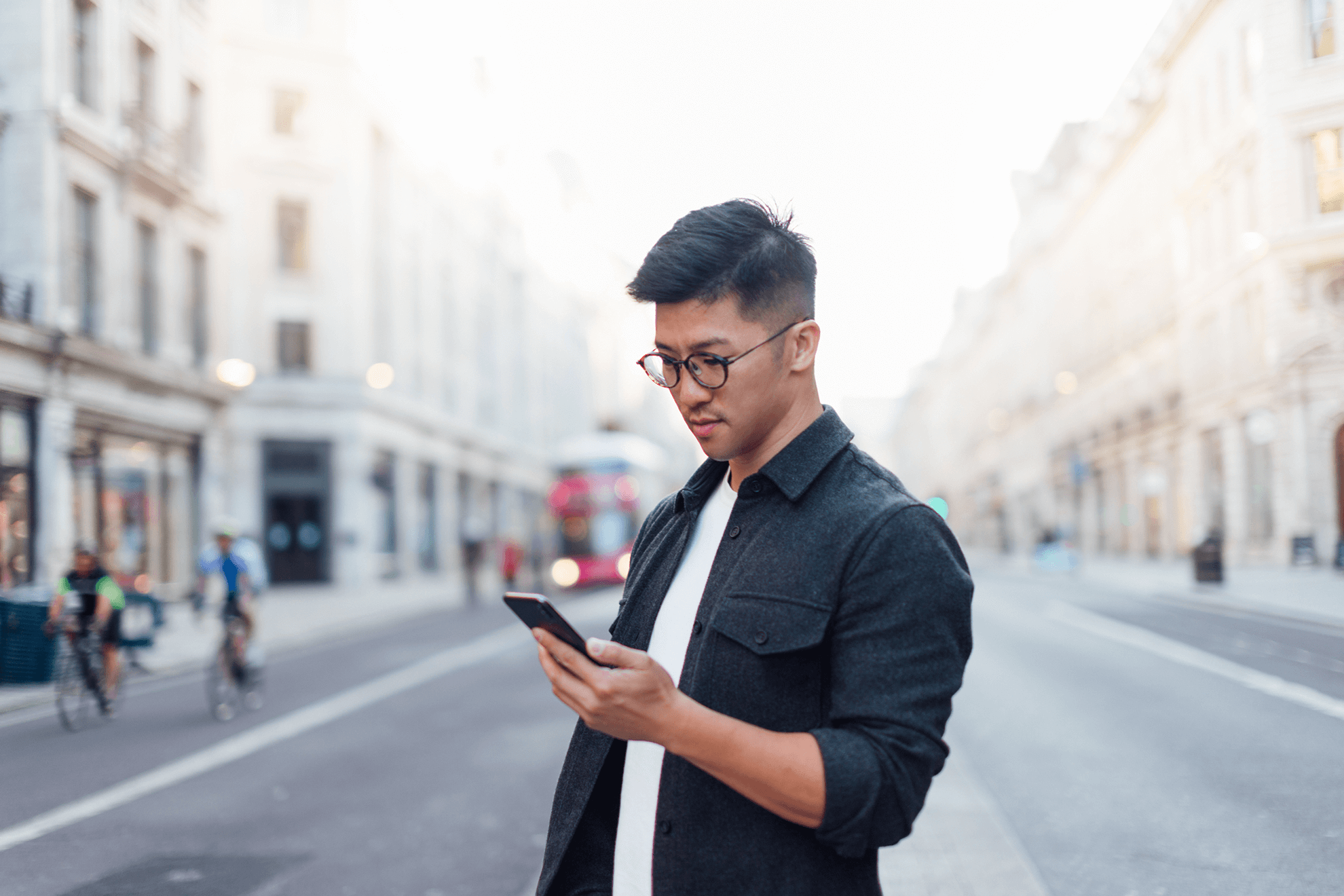 Man Looking At phone on the street