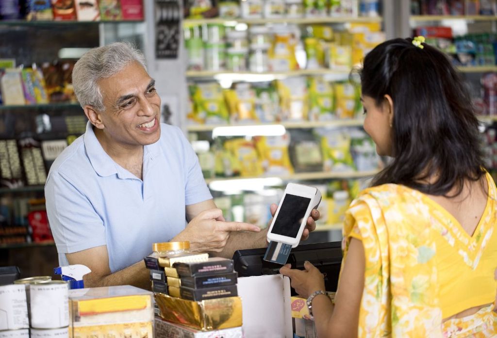 A pair of Indian shopper in a store talking