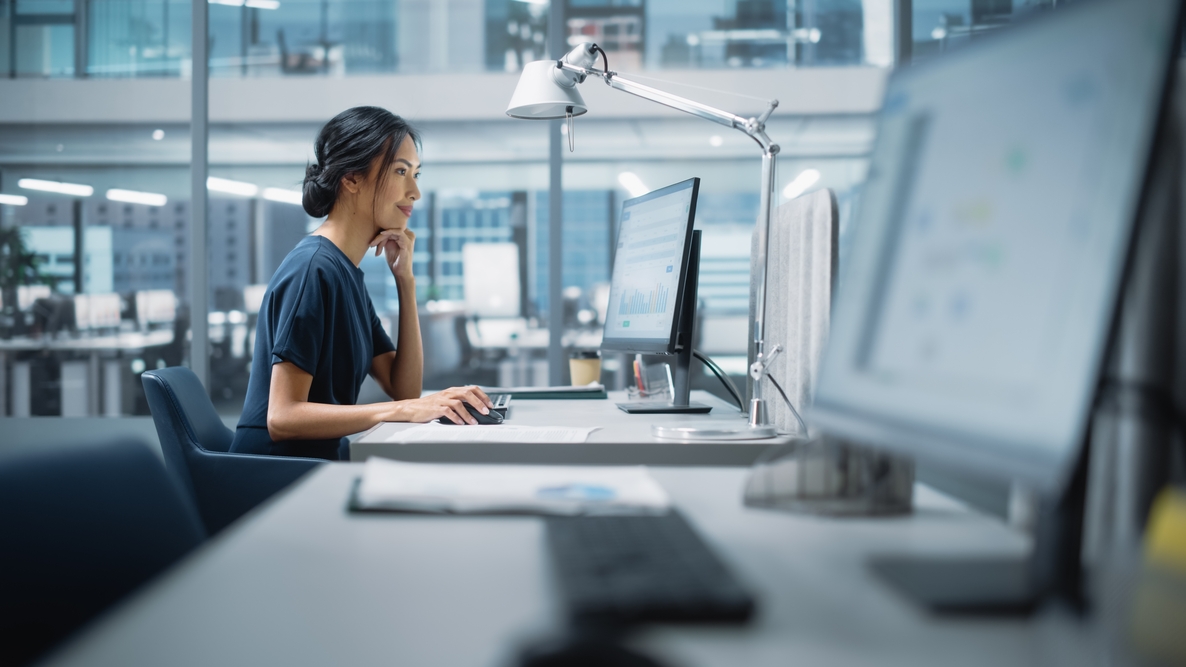Women in an office looking at a computer
