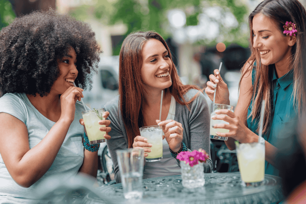 group of girls drinking coctails