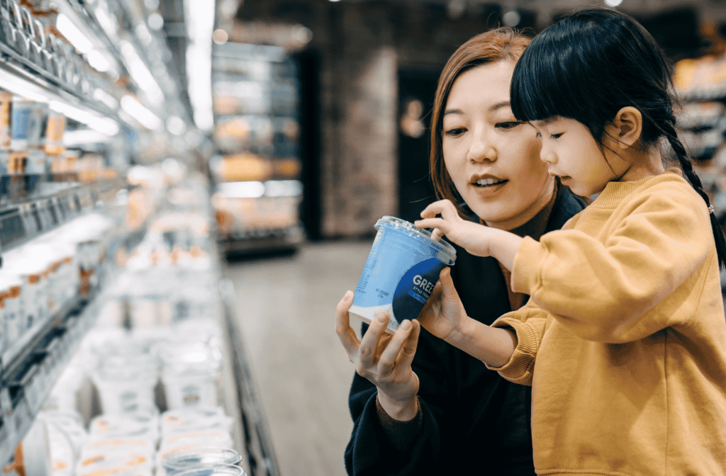 girl and mom in supermarket