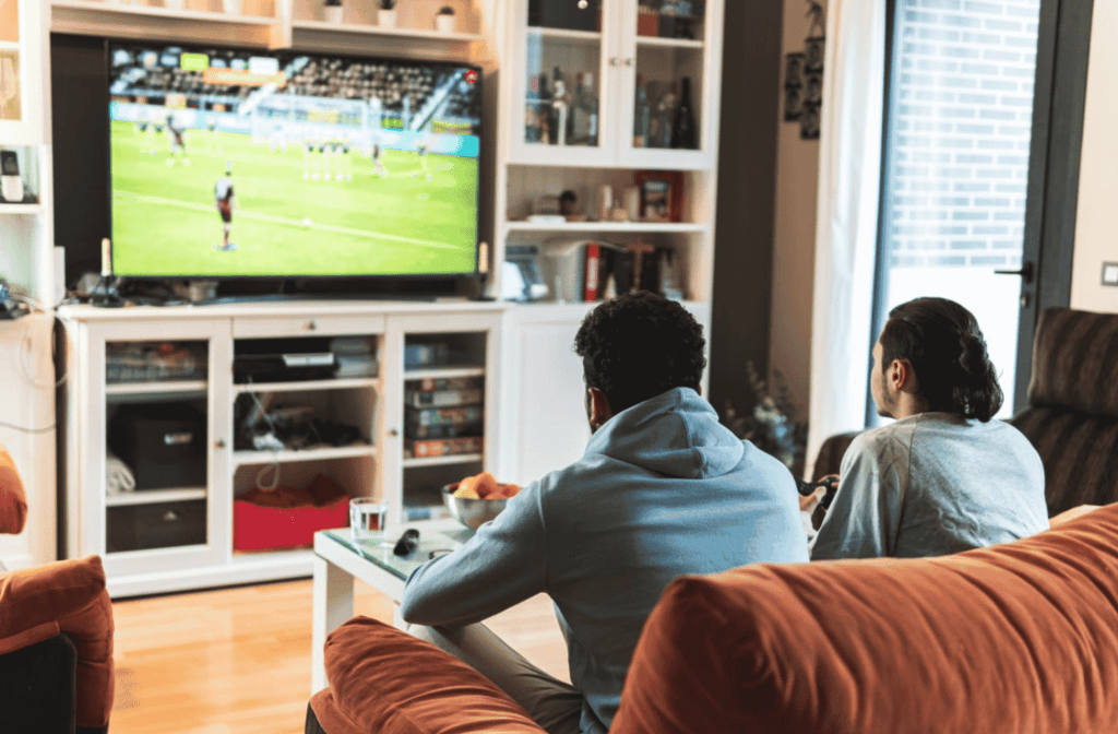 man playing soccer videogames