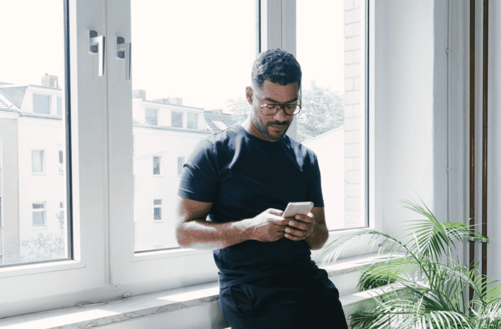 man using his phone for ai recommendations