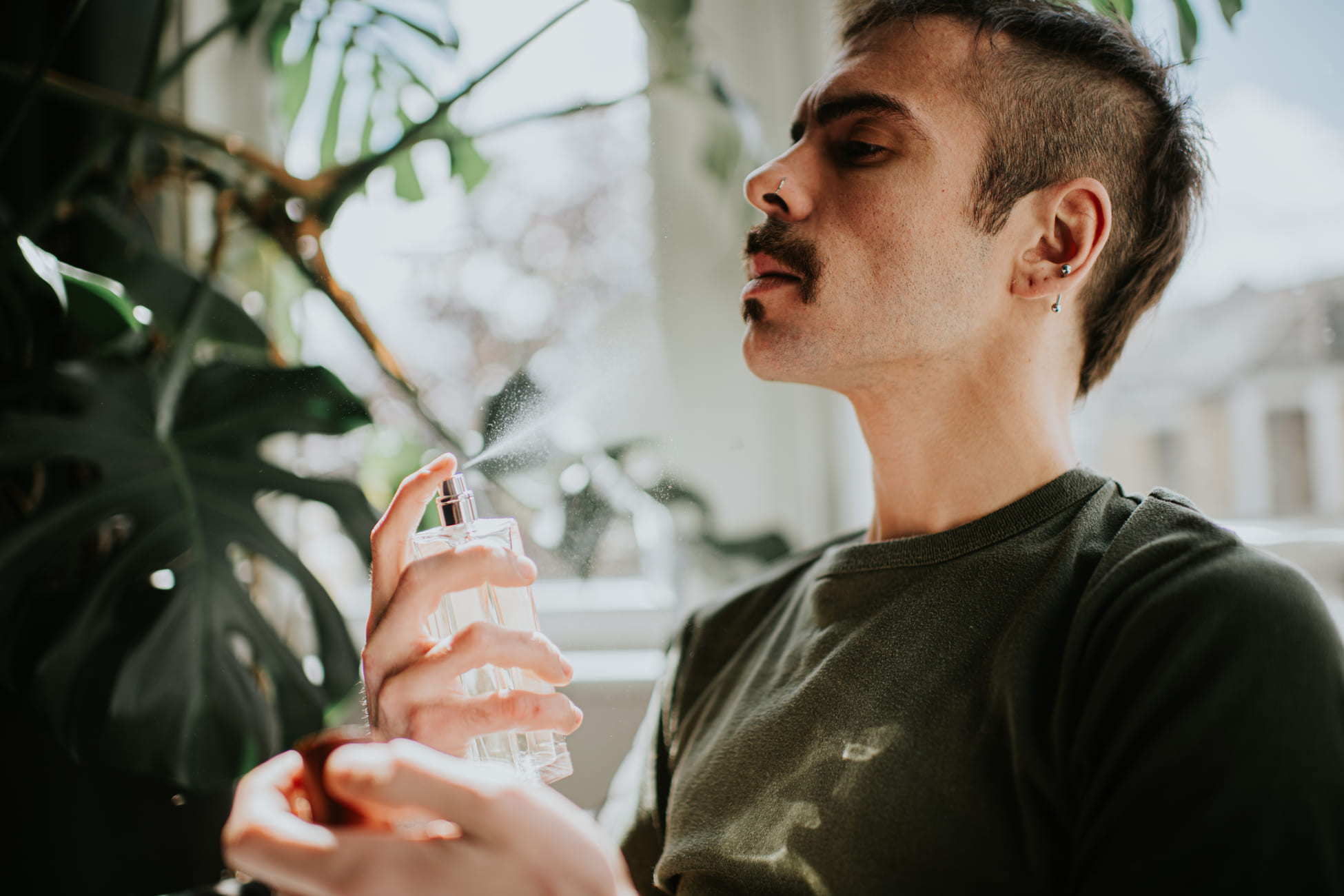 man using perfume