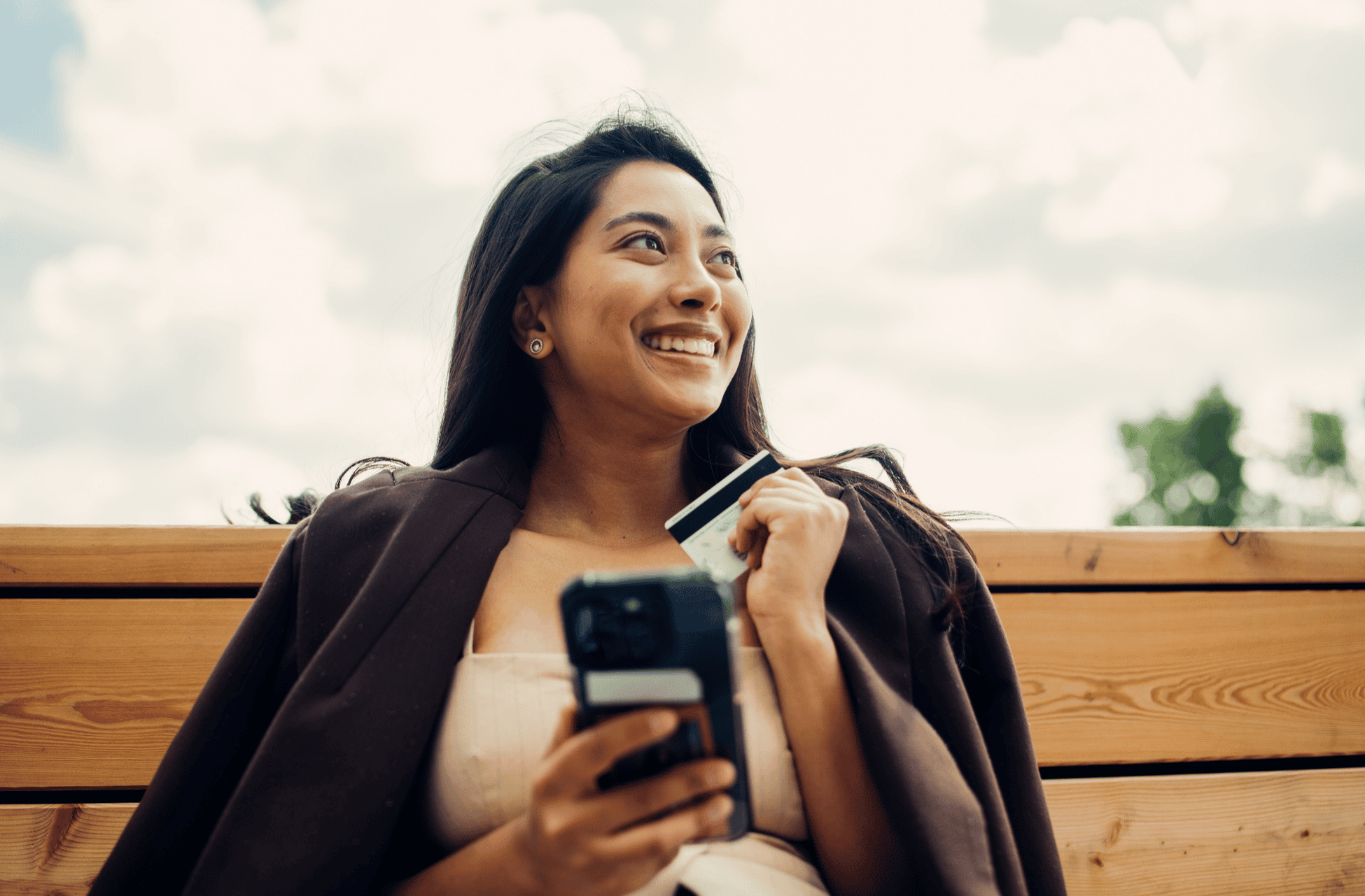 women with her phone buying beauty products