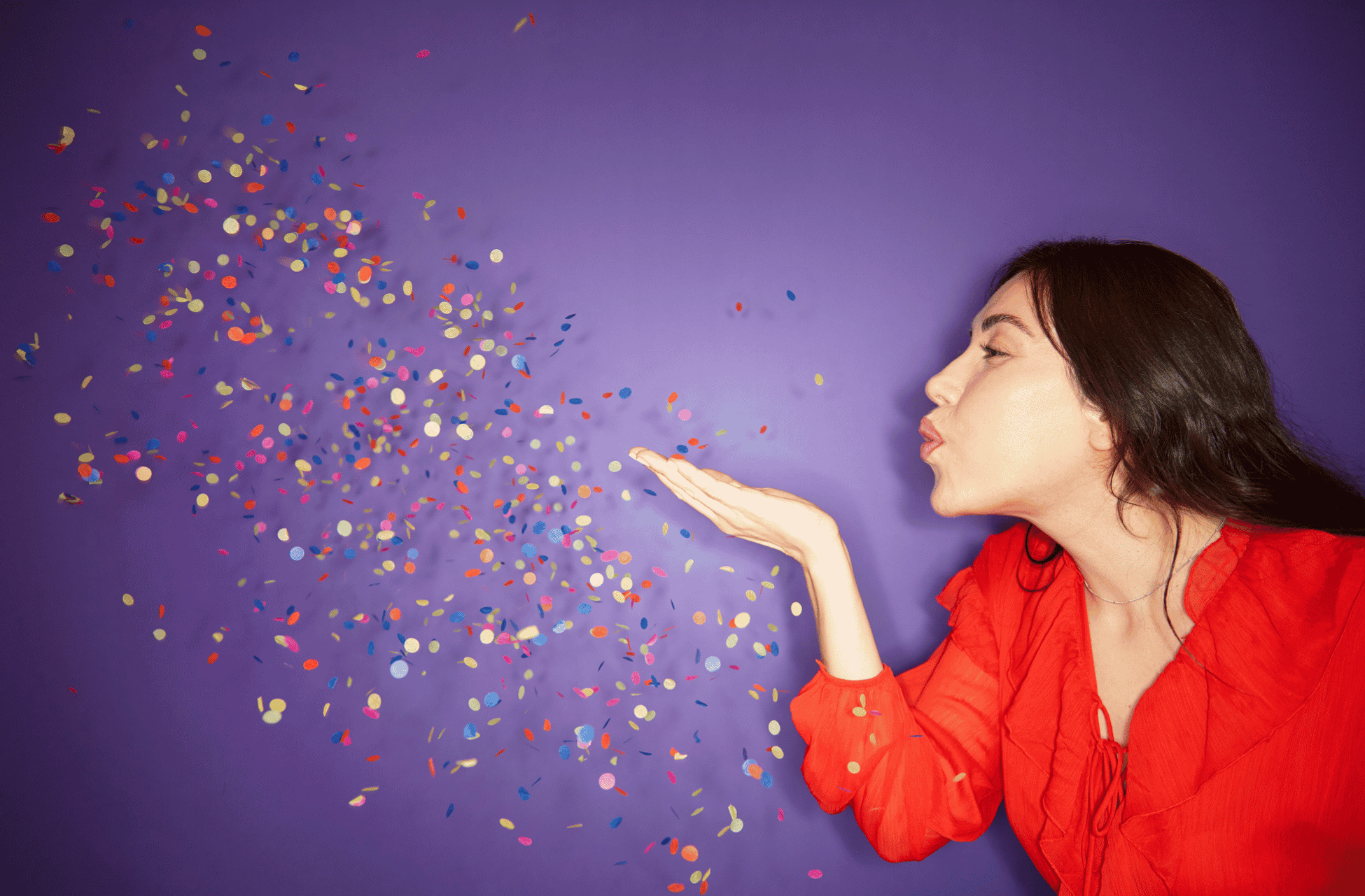 women celebrating in a purple background