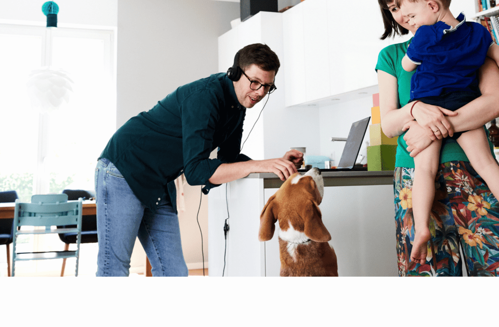 family playing with their dog
