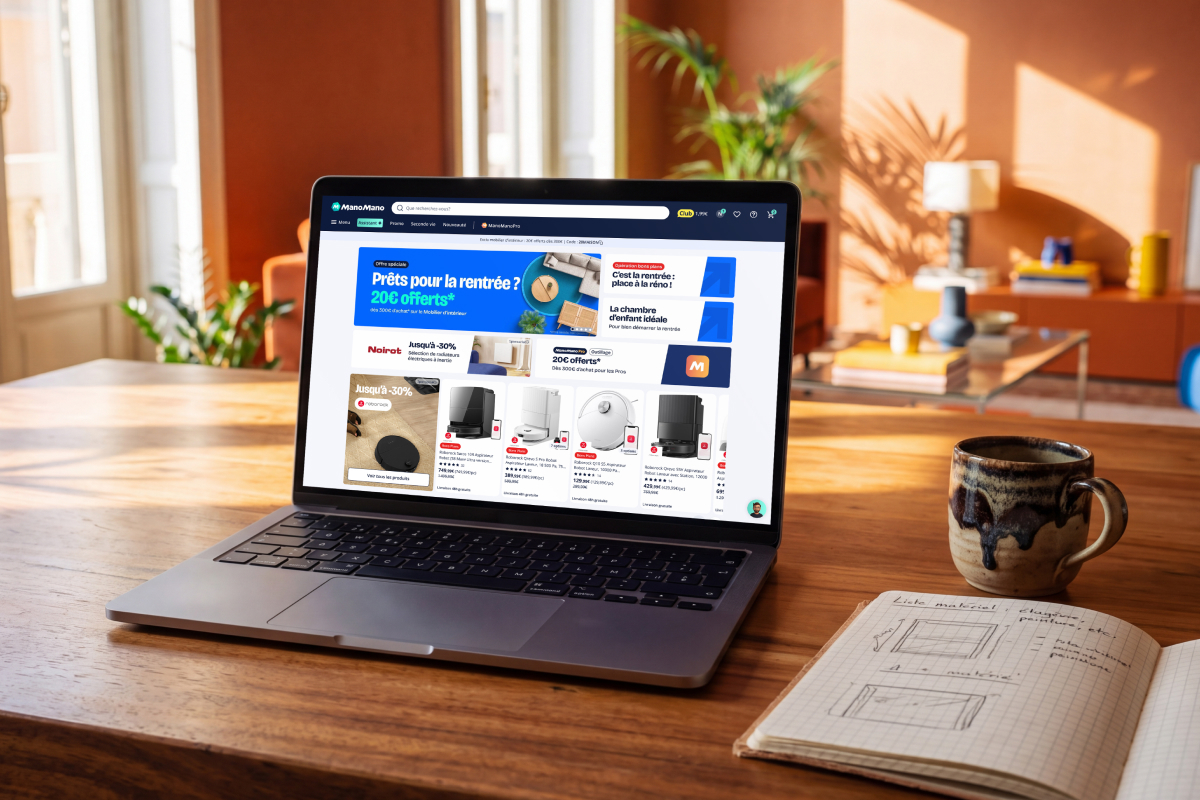 laptop with mano mano website on it