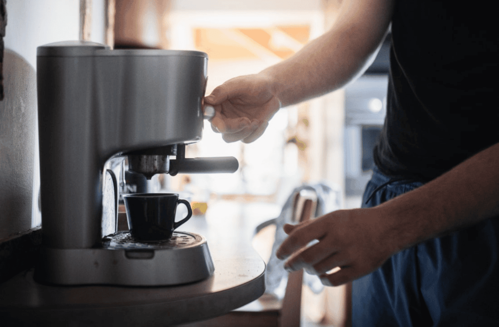 man making coffee